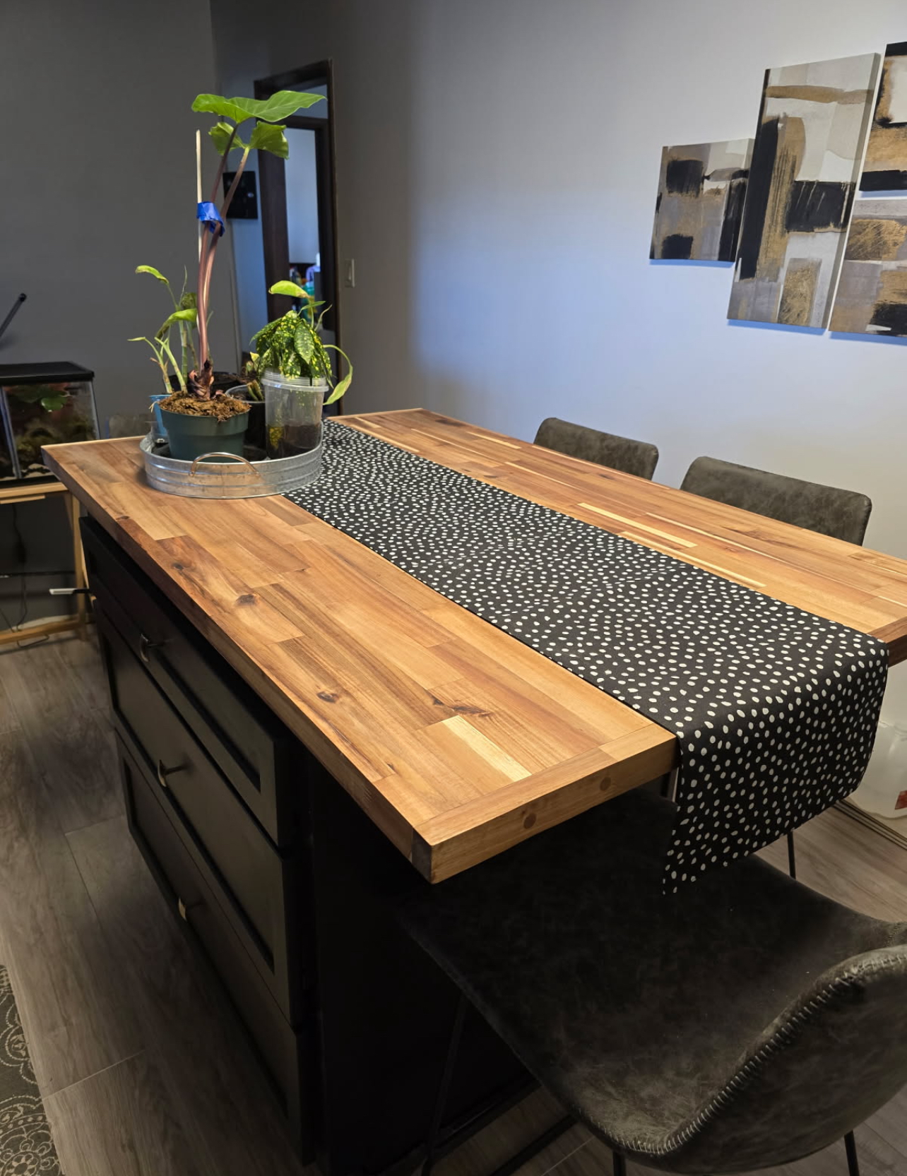 Butcher block dining island styled with a table runner