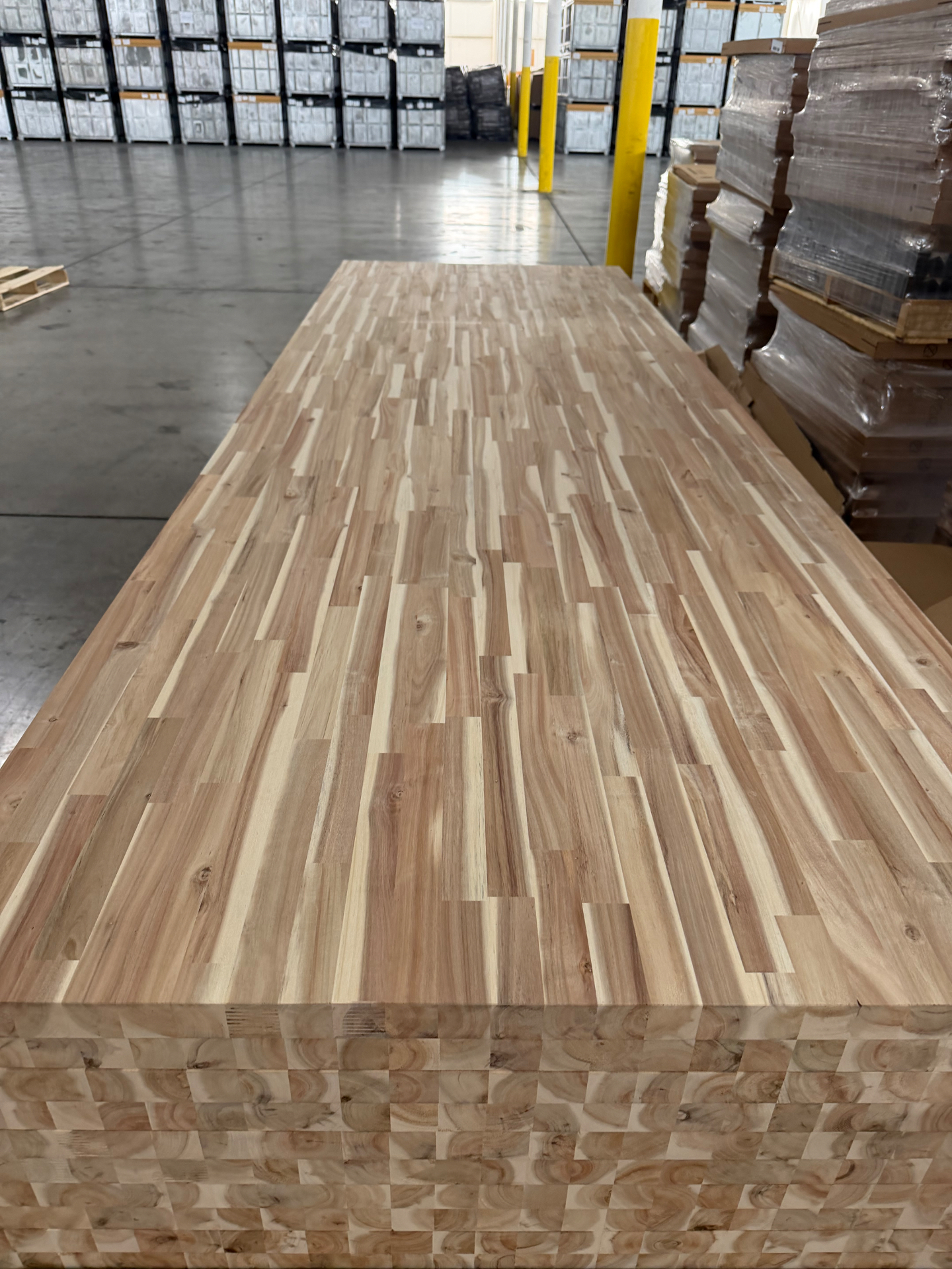 Full butcher block slab displayed in the warehouse